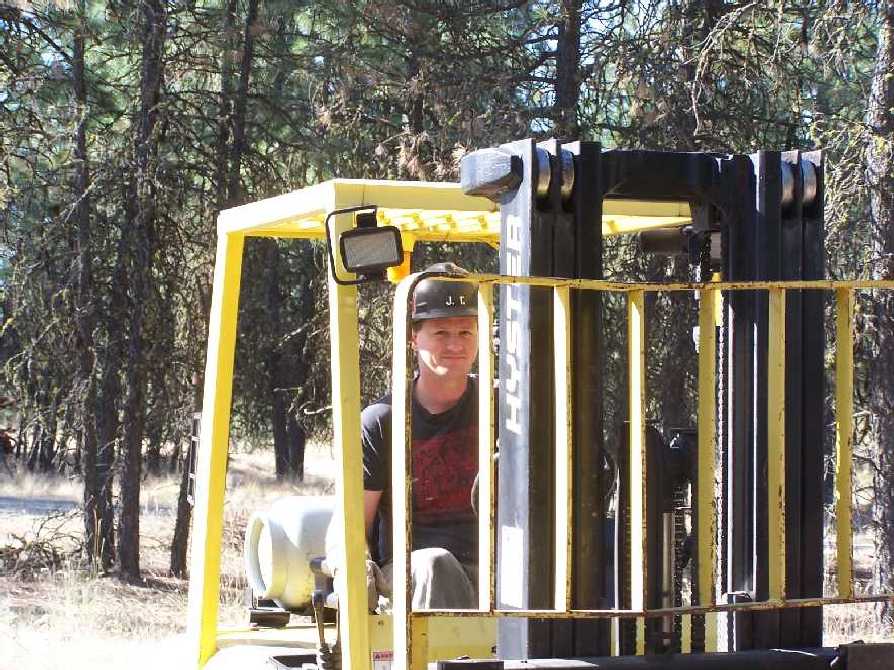 Justin drives the fork lift